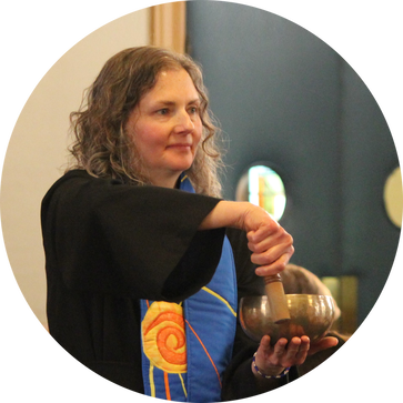 Rev. Paticia Hatch plays a singing bowl